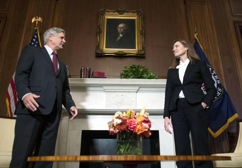 Supreme Court nominee Judge Amy Coney Barrett, meets with Sen. John Hoeven, N.D., Thursday, Oct. 1, 2020 at the Capitol in Washington. (Kevin Dietsch/Pool via AP)