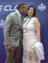 North Carolina tight end Eric Ebron kisses his mother Gina Jackson before the start of the first round of the 2014 NFL Draft, Thursday, May 8, 2014, in New York.