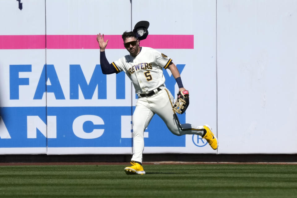 Milwaukee Brewers center fielder Garrett Mitchell chases down a double hit by San Diego Padres' Jake Cronenworth during the fourth inning of a spring training baseball game Thursday, March 23, 2023, in Phoenix. (AP Photo/Ross D. Franklin)