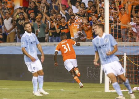 Jul 18, 2018; Houston, TX, USA; Houston Dynamo forward Romell Quioto (31) celebrates after scoring a goal during the second half against Sporting Kansas City at BBVA Compass Stadium. Mandatory Credit: Troy Taormina-USA TODAY Sports