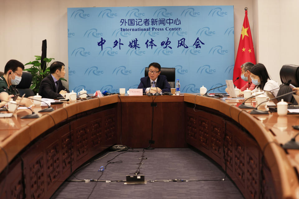 Director of the Chinese Foreign Ministry's Africa Department, Wu Peng, center, takes part in a briefing at the Foreign Ministry in Beijing on Thursday, May 20, 2021. Wu told reporters on Thursday that China is currently providing COVID-19 vaccines to nearly 40 African countries and that the vaccines were either being donated or sold at "favorable prices." (AP Photo/Ng Han Guan)
