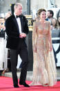 <p>For their big night out, Kate wore a gold, beaded Jenny Packham gown with a dramatic cape while William opted for a velvet jacket with satin lapels and black cashmere slippers by Arthur Sleep.</p>