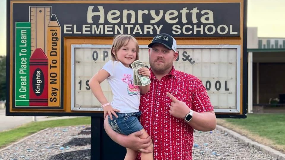 Kaisley Blake shows off her gift from the tooth fairy with father Worren Blake.  - Courtesy Worren Blake