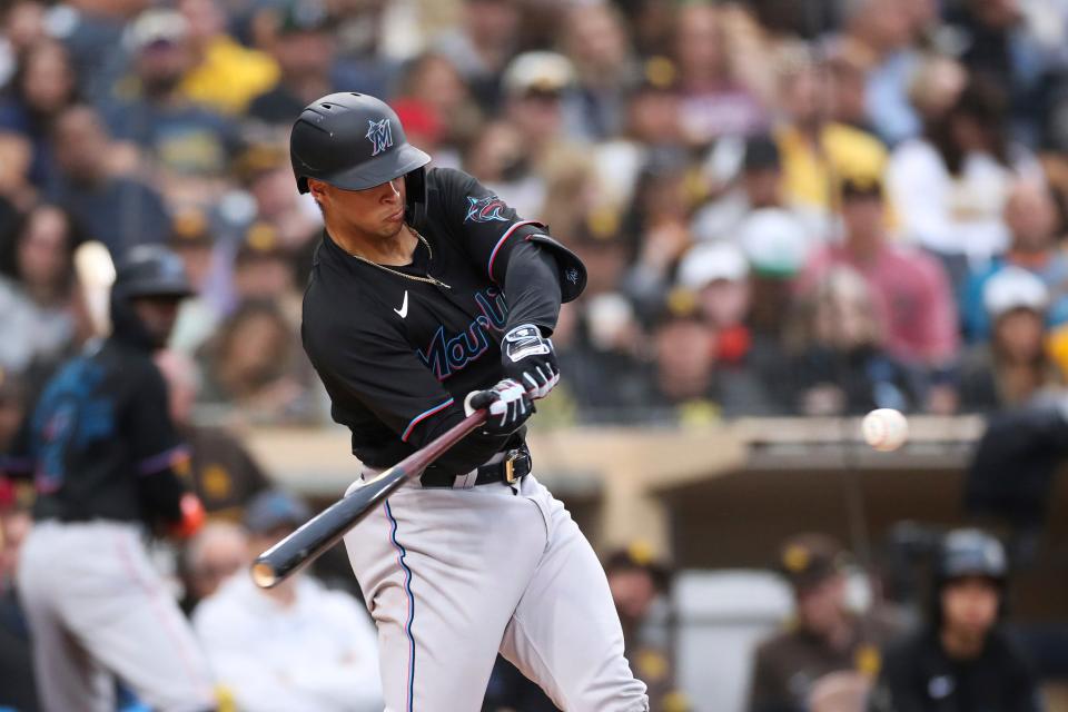 Miami Marlins' Joe Dunand hits a solo home run against San Diego Padres' Sean Manaea in the third inning of a baseball game Saturday, May 7, 2022, in San Diego. The home run was Dunand's first career hit. (AP Photo/Derrick Tuskan)