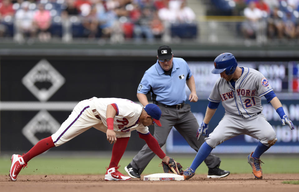 New York Mets' Todd Frazier (21) slides into second base ahead of a tag from Philadelphia Phillies' Cesar Hernandez (16) in the second inning of a baseball game, Saturday, Aug. 18, 2018, in Philadelphia. (AP Photo/Michael Perez)