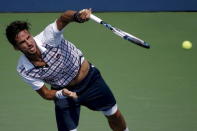 Feliciano Lopez of Spain serves to Mardy Fish of the U.S. during their match at the U.S. Open Championships tennis tournament in New York, September 2, 2015. REUTERS/Mike Segar