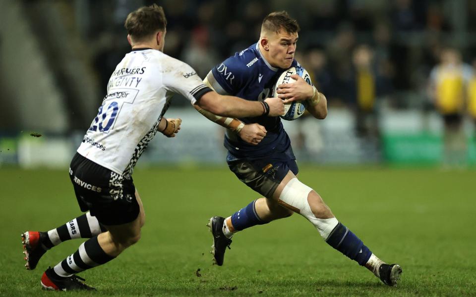 Joe Carpenter of Sale Sharks is tackled by AJ MacGintyder during the Gallagher Premiership Rugby match between Sale Sharks and Bristol Bears at the AJ Bell Stadium on January 05, 2024 in Salford, England