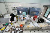 Employees register bags of blood at a blood transfusion centre in Sanaa, Yemen August 7, 2017. Picture taken August 7, 2017. REUTERS/Khaled Abdullah