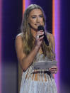 Ingrid Andress presents the award for male artist of the year at the 56th annual Academy of Country Music Awards on Sunday, April 18, 2021, at the Grand Ole Opry in Nashville, Tenn. (AP Photo/Mark Humphrey)