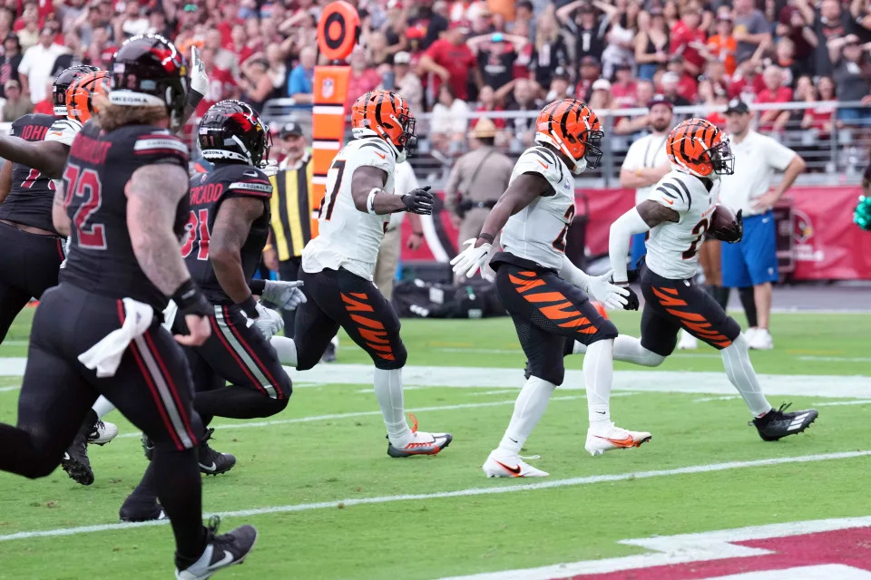 Cincinnati Bengals cornerback Cam Taylor-Britt returns an interception for a touchdown