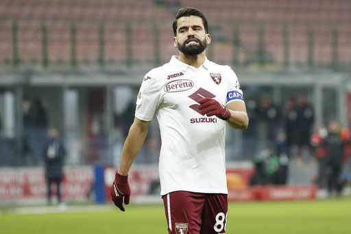 Torino's Tomas Rincon reacts after failing to score from a penalty shot during the Italian Cup round of 16 soccer match between AC Milan and Torino at the San Siro stadium, in Milan, Italy, Tuesday, Jan. 12, 2021. (AP Photo/Antonio Calanni)