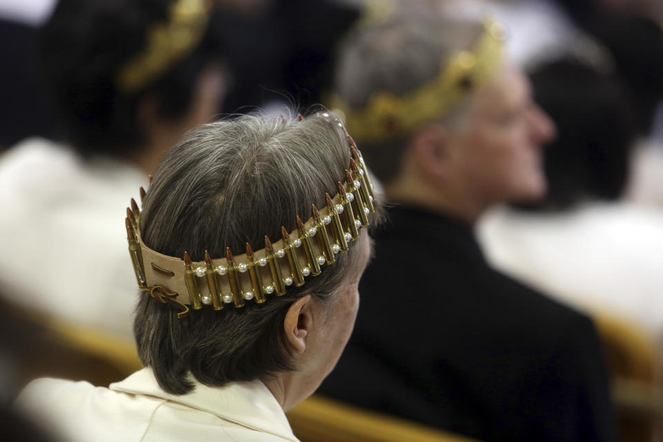 <p>A woman wears a crown made of ammunition during services at the World Peace and Unification Sanctuary, Wednesday Feb. 28, 2018 in Newfoundland, Pa. (Photo: Jacqueline Larma/AP) </p>