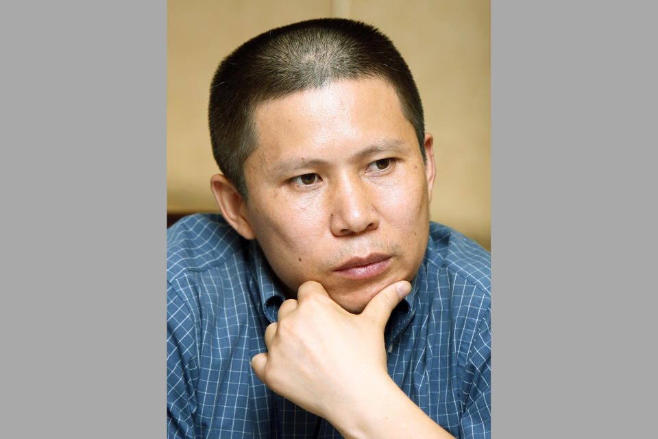 FILE - Legal scholar Xu Zhiyong is seen at a meeting in Beijing, China, on July 17, 2009. Xu and Ding Jiaxi, two prominent Chinese human rights lawyers, have been sentenced to more than a decade in prison, Human Rights Watch said Monday, April 10, 2023, the latest in a crackdown by the ruling Communist Party on its critics. (AP Photo/Greg Baker, File)