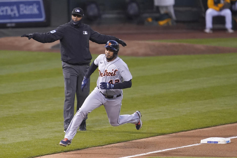 Detroit Tigers' Jeimer Candelario runs home to score against the Oakland Athletics during the fourth inning of a baseball game in Oakland, Calif., Thursday, April 15, 2021. (AP Photo/Jeff Chiu)