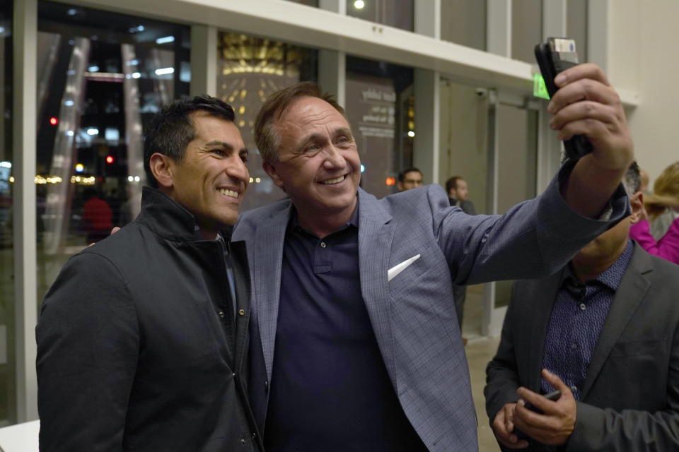 Assemblyman Robert Rivas, D-Hollister, left, smiles as he takes a selfie with Democratic Assemblyman-elect Rick Chavez Zbur, after being elected Speaker-Designee Thursday, Nov. 10, 2022. With the addition of Chavez Zbur and other LGBTQ lawmakers, 10% of the California state Legislature now identifies as LGBTQ. (AP Photo/Rich Pedroncelli)