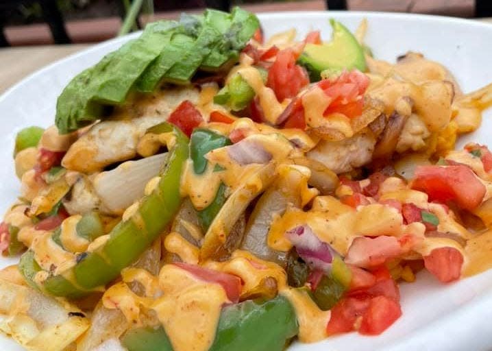 New on the menu at Brack's Grille & Tap is this Chicken Burrito Bowl made with blackened chicken sautéed with fajita onions, peppers and tomato, served over spanish rice with chipotle ranch drizzle and sliced avocado.