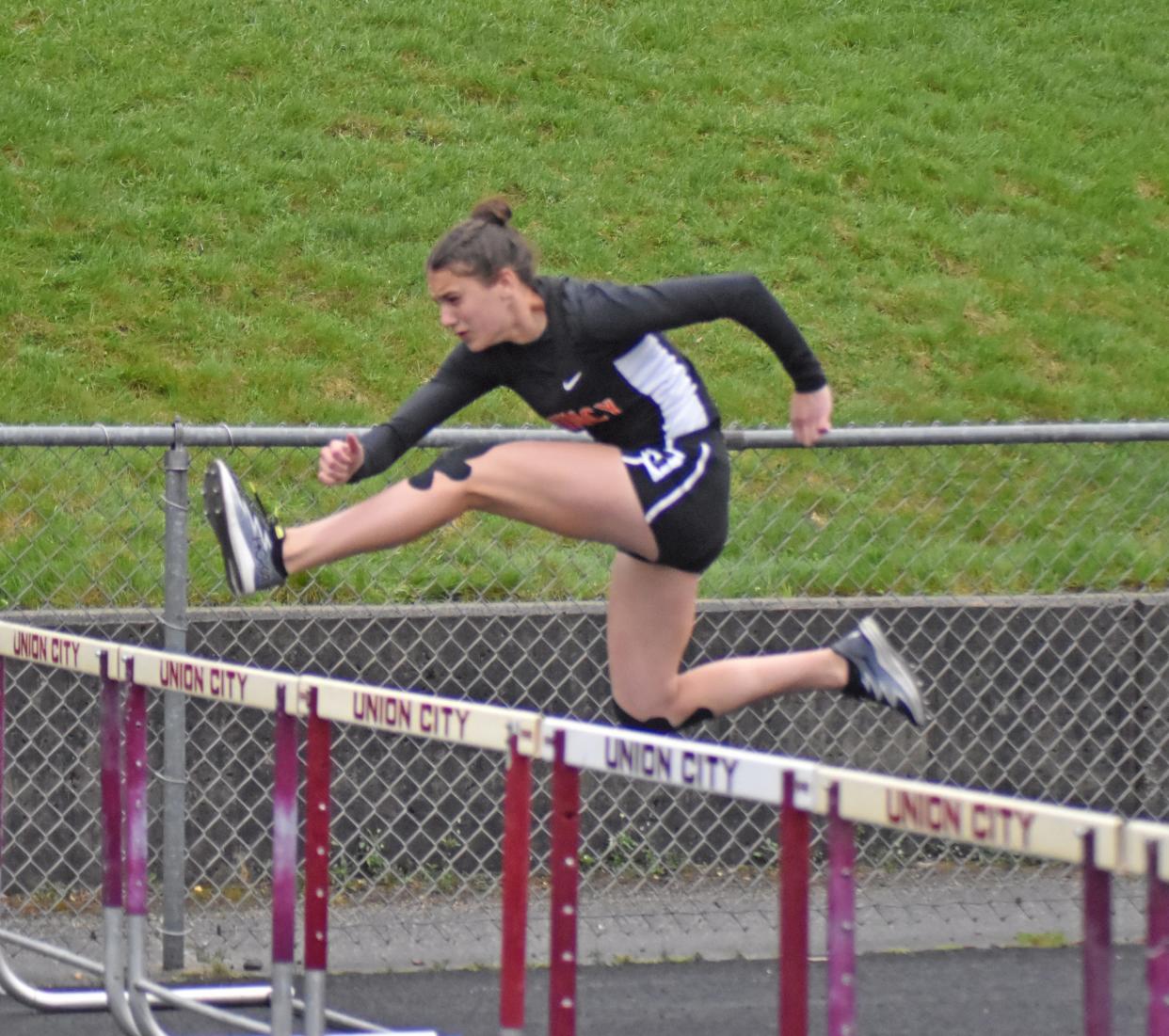 Union City's Brookelyn Parker, shown here during last season, swept the hurdle events for Quincy on Wednesday