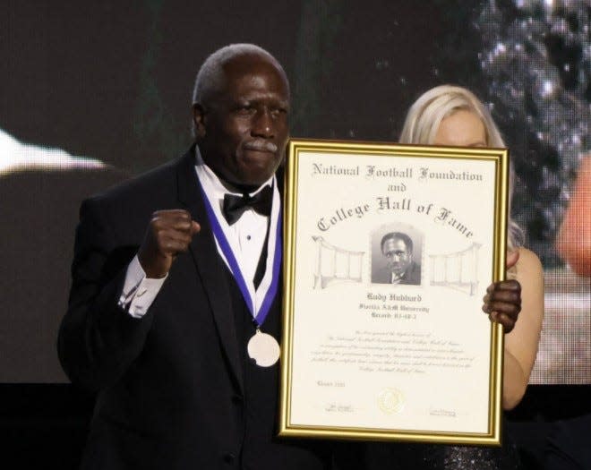 Former FAMU football coach Rudy Hubbard receives his award as an inductee in the College Football Hall of Fame during the 63 Annual National Football Foundation Awards Dinner in Las Vegas on Tuesday, Dec. 7, 2021.