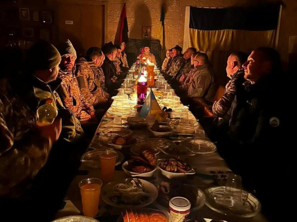 Ukrainian service members have Christmas dinner at an unknown location in Ukraine (Ukraine military handout via REUTERS)