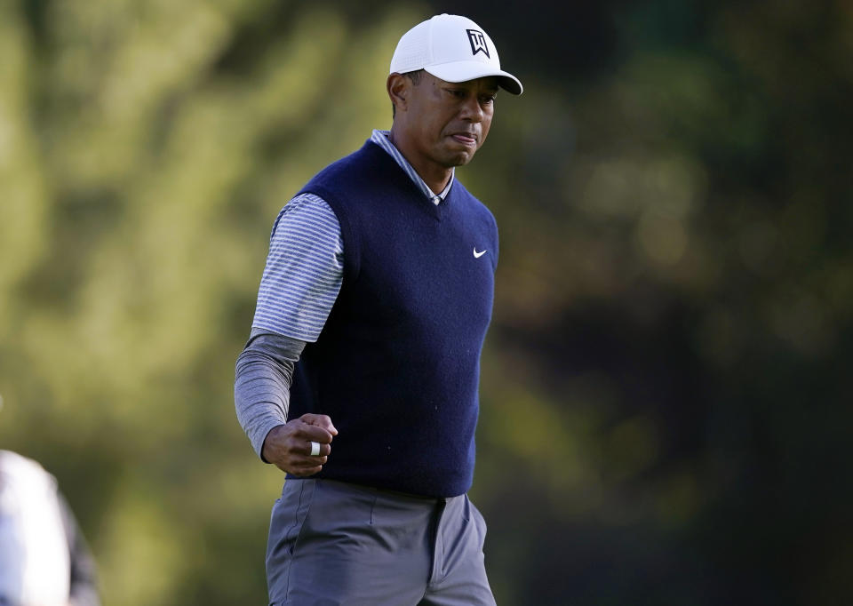 Tiger Woods fist pumps after making a putt for birdie on the 12th hole during the third round of the Genesis Open golf tournament at Riviera Country Club on Saturday, Feb. 16, 2019, in the Pacific Palisades area of Los Angeles. (AP Photo/Ryan Kang)