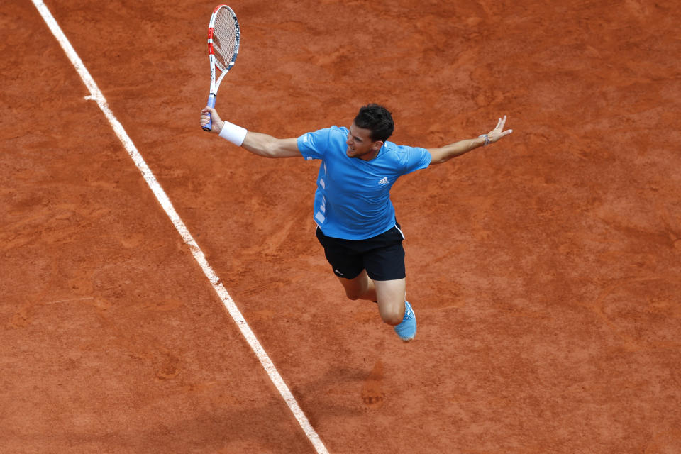 FILE - In this June 9, 2019, file photo, Austria's Dominic Thiem returns the ball to Spain's Rafael Nadal during the men's final match of the French Open tennis tournament at Roland Garros stadium in Paris. (AP Photo/Pavel Golovkin, File)