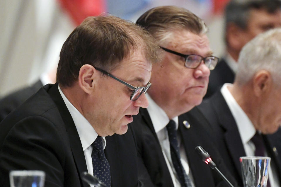 Finnish Prime Minister Juha Sipil', left, and Foreign Minister Timo Soini attend at the Ministers for Foreign Affairs of the Council of Europe's annual meeting in Helsinki, Finland Friday, May 17, 2019. (Vesa Moilanen/Lehtikuva via AP)