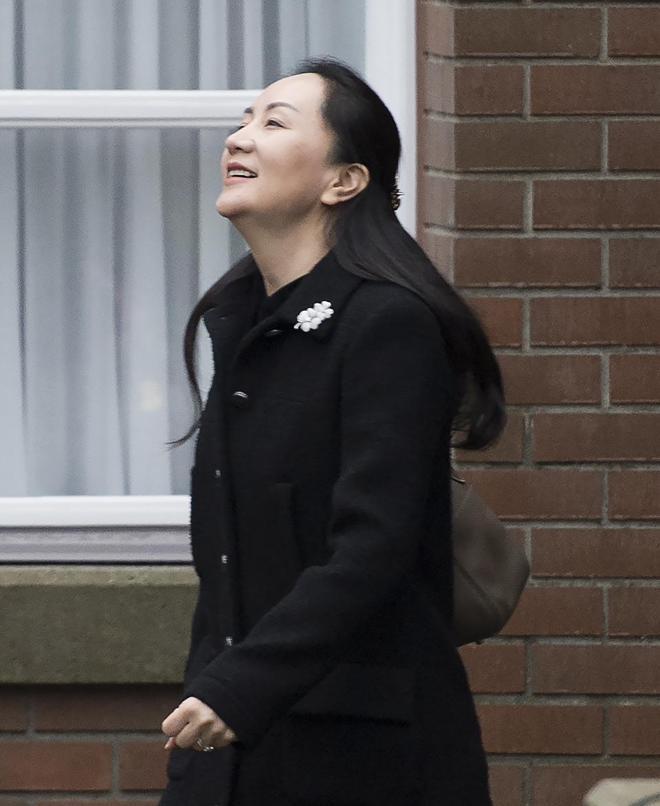 Meng Wanzhou, chief financial officer of Huawei leaves her home in Vancouver, Monday, January, 20, 2020. A court hearing begins today in Vancouver over the American request to extradite an executive of the Chinese telecom giant Huawei on fraud charges. (Jonathan Hayward/The Canadian Press via AP)