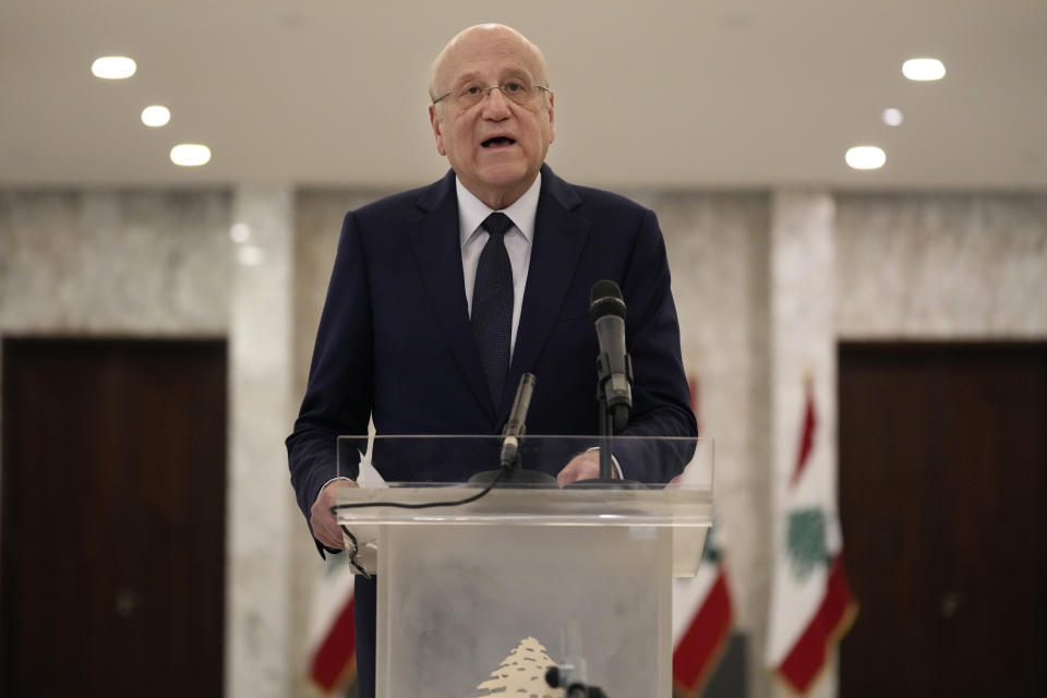 Lebanese Prime Minister-designate Najib Mikati, speaks to journalists after his meeting with Lebanese President Michel Aoun, at the Presidential Palace in Baabda, east of Beirut, Lebanon, Thursday, June 23, 2022. President Aoun appointed Mikati, a billionaire businessman and former prime minister as the next premier-designate after his consultations with members of parliamentary blocs to name a new prime minister following last month's parliamentary elections. (AP Photo/Hussein Malla)