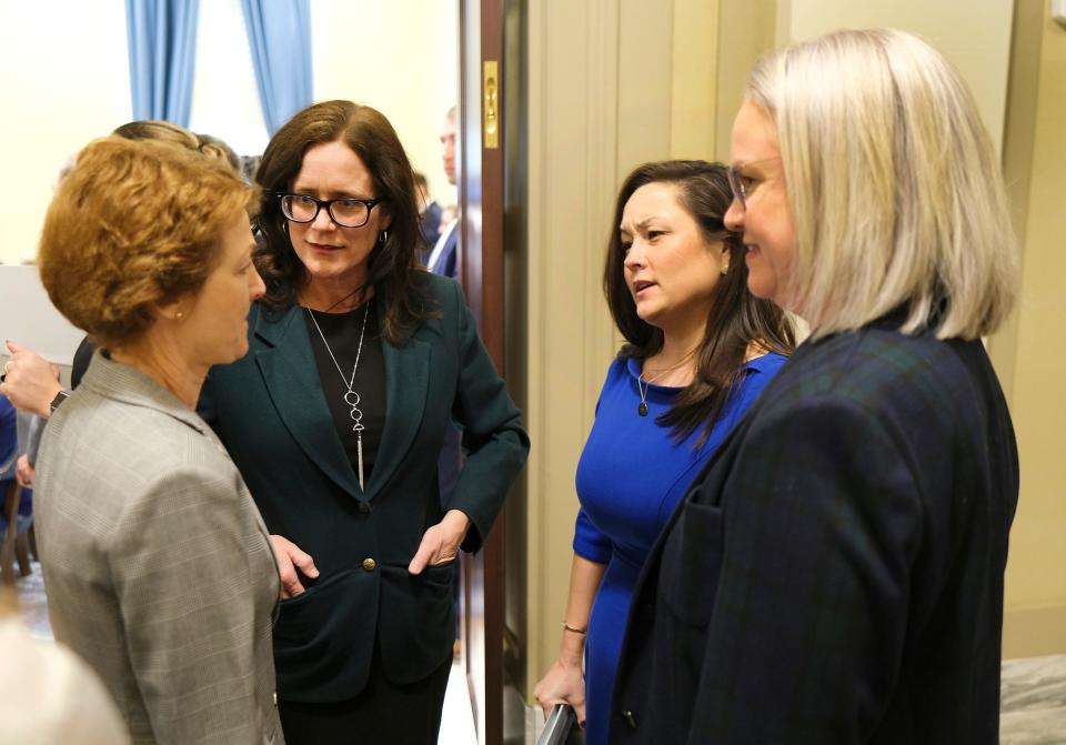 Sens.  Kay Floyd and Julia Kirt, left, visit Reps. Cyndi Munson and Trish Ranson during the grocery tax cut signing ceremony in the Blue Room of the Oklahoma Capitol on Feb. 27.