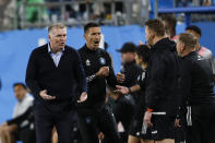 Charlotte FC coach Dean Smith, left, argues a call during the second half of the team's MLS soccer match against Toronto FC in Charlotte, N.C., Saturday, April 13, 2024. (AP Photo/Nell Redmond)