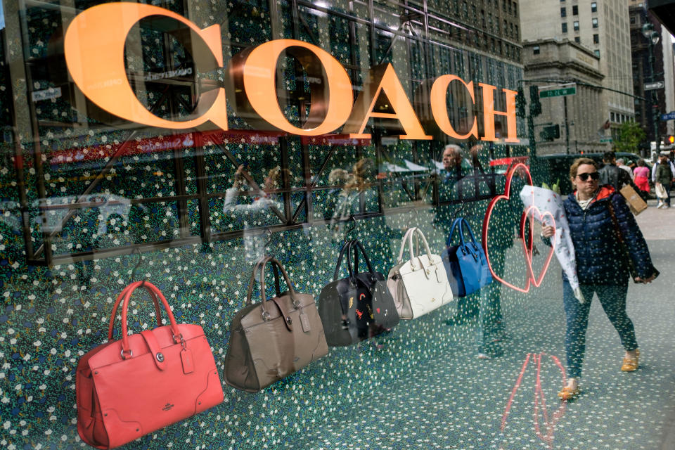 NEW YORK, NY - MAY 12: A woman walks past Coach bags in a window of Macy's flagship store, May 12, 2017 in the Herald Square neighborhood in New York City. The U.S. Commerce Department says retail sales rose 0.4 percent in April from March. (Photo by Drew Angerer/Getty Images)