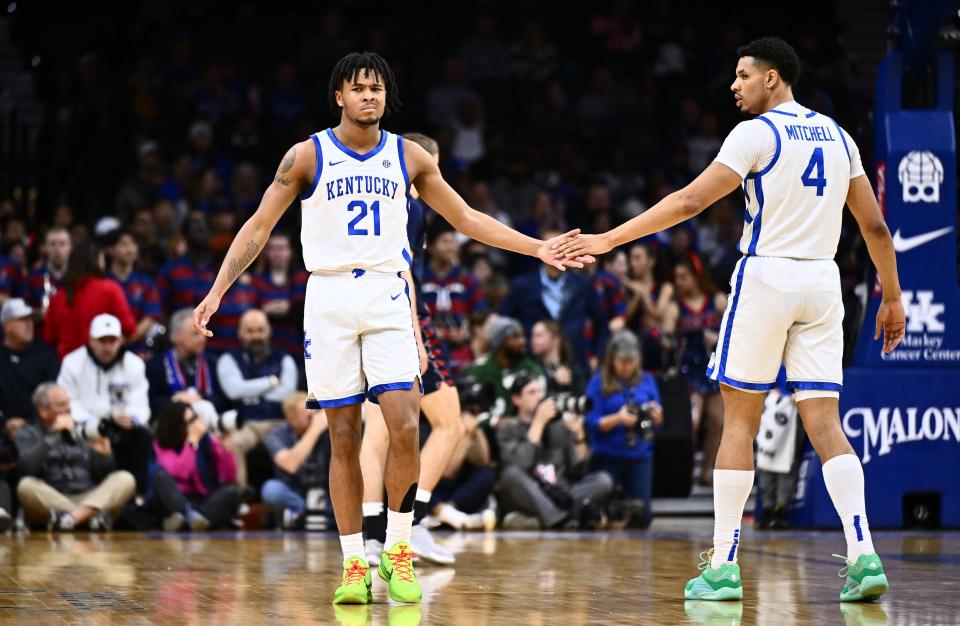 Dec 9, 2023; Philadelphia, Pennsylvania, USA; Kentucky Wildcats guard D.J. Wagner (21) reacts with forward Tre Mitchell (4) in the first half against the Penn Quakers at Wells Fargo Center. Mandatory Credit: Kyle Ross-USA TODAY Sports