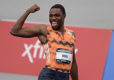 Jun 22, 2018; Des Moines, IA, USA; Noah Lyles left) reacts after defeating Ronnie Baker (not pictured) to win the 100m, 9.88 to 9.90, during the USA Championships at Drake Stadium. Bryce Robinson (right) was seventh in 10.55. Mandatory Credit: Kirby Lee-USA TODAY Sports