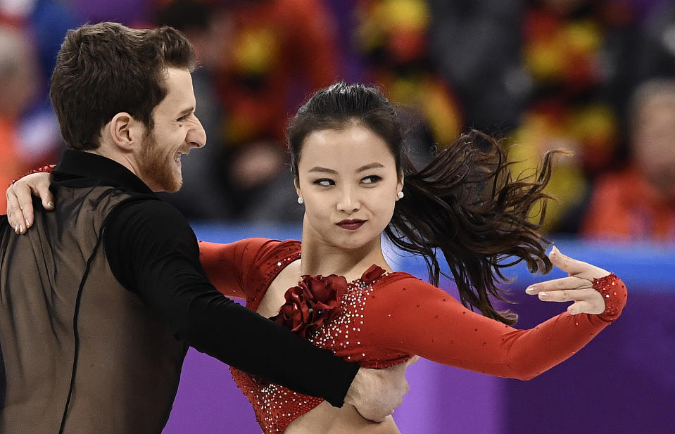 <p>South Korea’s Yura Min and South Korea’s Alexander Gamelin compete in the figure skating team event ice dance short dance during the Pyeongchang 2018 Winter Olympic Games at the Gangneung Ice Arena in Gangneung on February 11, 2018. / AFP PHOTO / ARIS MESSINIS </p>