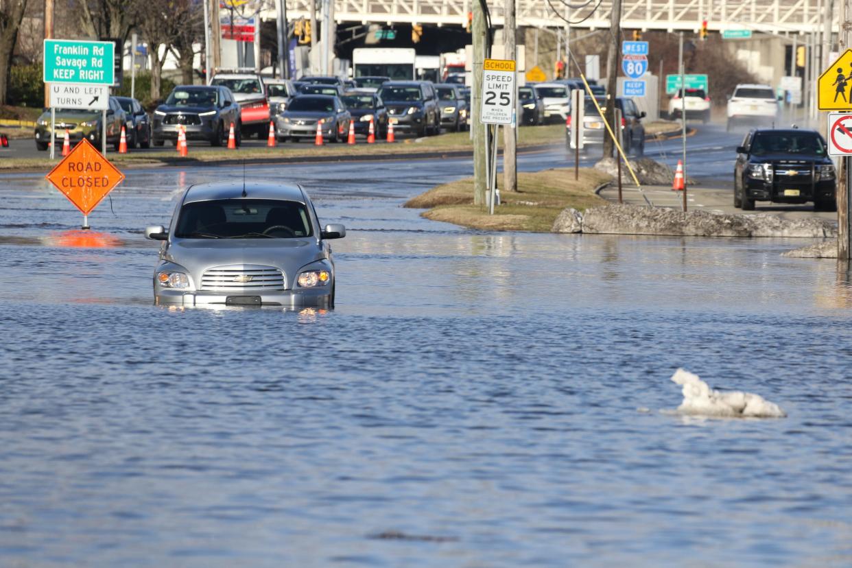 Denville, NJ — January 10, 2024 -- A car stuck in the water on West Main St. in Denville