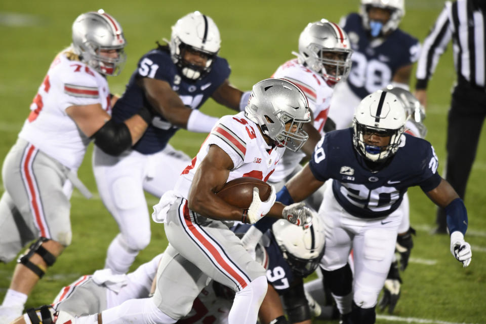 Ohio State running back Master Teague (33) carries against Penn State in the first quarter of an NCAA college football game in State College, Pa., Saturday, Oct. 31, 2020. (AP Photo/Barry Reeger)