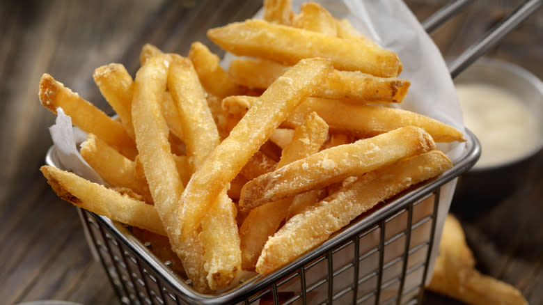 crisp french fries in wire basket