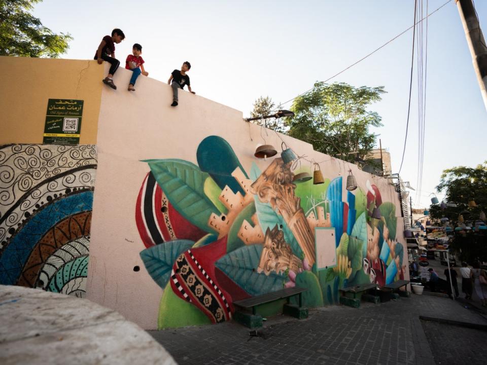 Many of Amman’s buildings are painted with colourful street art murals (Jack Lawes)