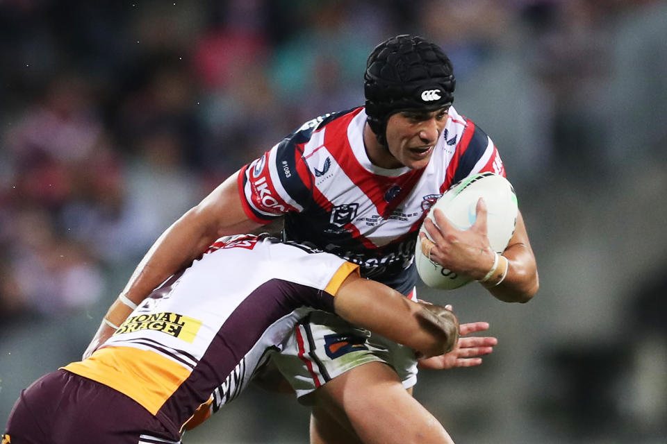 Pictured here, Roosters young gun Joseph Suaalii gets tackled against Brisbane in the NRL.