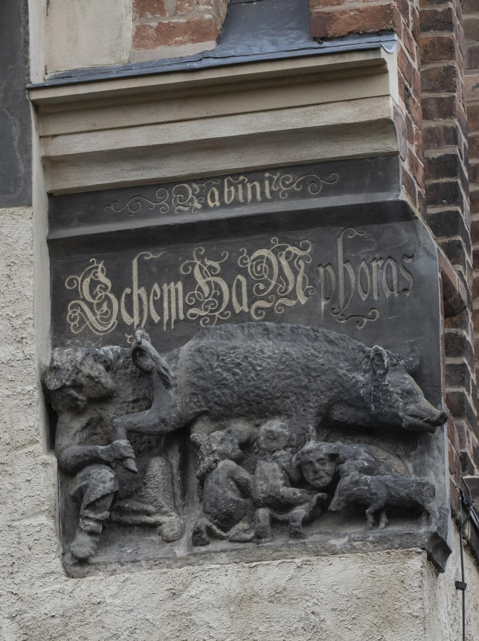 In this Tuesday, Jan. 14, 2020 photo the so-called “Judensau,” or “Jew pig,” sculpture is displayed on the facade of the Stadtkirche (Town Church) in Wittenberg, Germany. A court in eastern Germany will consider next week a Jewish man’s bid to force the removal of an ugly remnant of centuries of anti-Semitism from a church where Martin Luther once preached. (AP Photo/Jens Meyer)