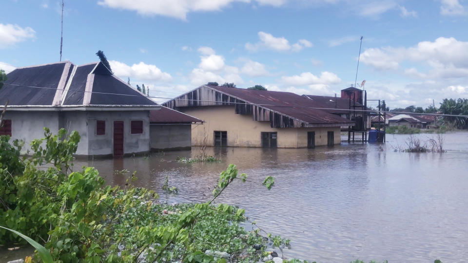 Partially submerged houses in a residential area in Bayelsa Nigeria, Thursday, Oct. 20, 2022. More than 600 people have been killed so far this year and 1.3 million forced from their homes by Nigeria’s worst floods in a decade. Authorities are blaming the disaster on unusually heavy rainfall and the release of excess water from the Lagdo dam in neighboring Cameroon. (AP Photo/Reed Joshua)