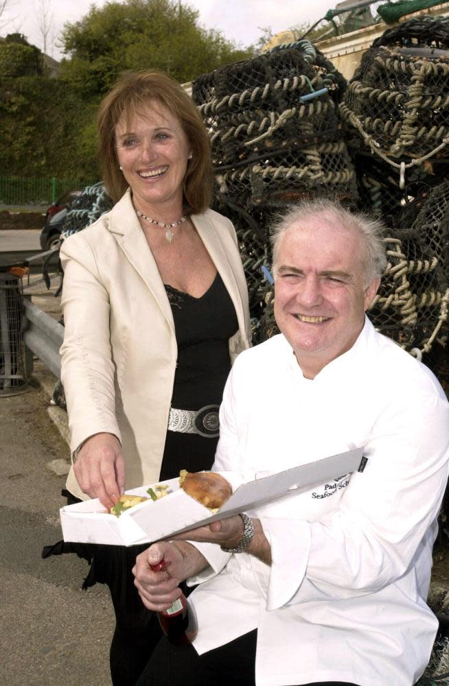 Stein and his first wife, Jill, at one of their fish and chip shops in 2004. Despite their divorce, they run the business together.