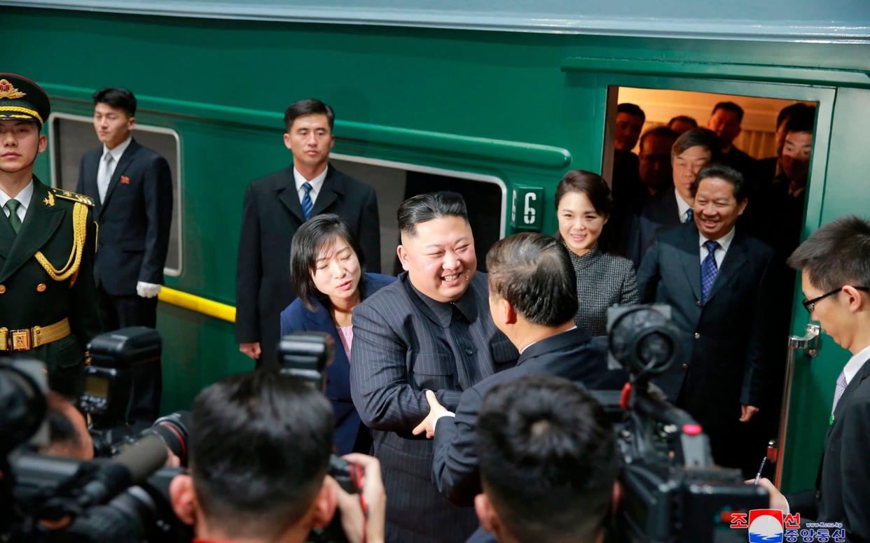 North Korean leader Kim Jong Un bids farewell to Chinese Communist Party's International Department head Song Tao at a station in the Chinese border town of Dandong - KCNA via KNS