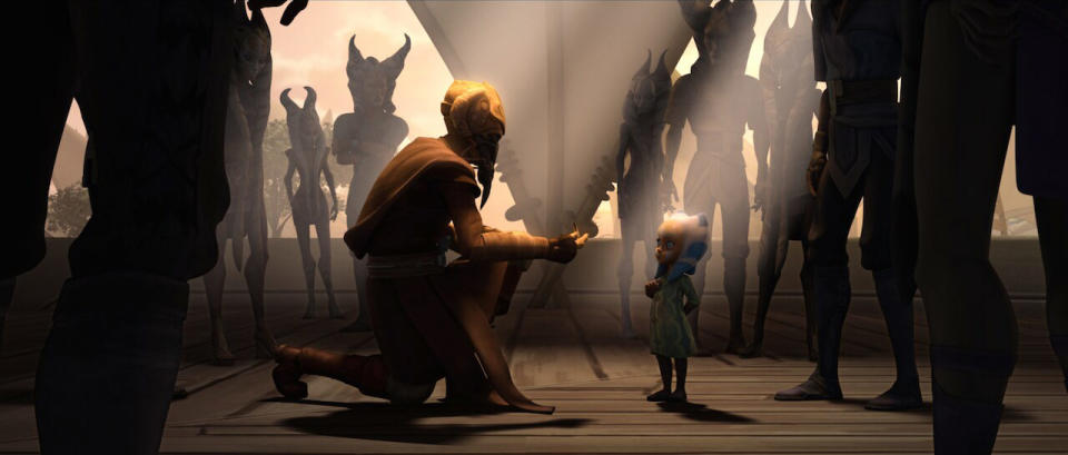 Plo Koon reaching out to a young Ahsoka