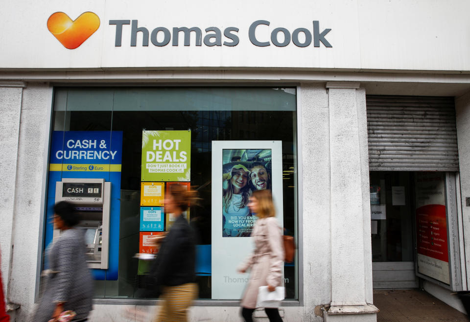 People walk past a closed Thomas Cook store in London, Britain, September 23, 2019. REUTERS/Henry Nicholls