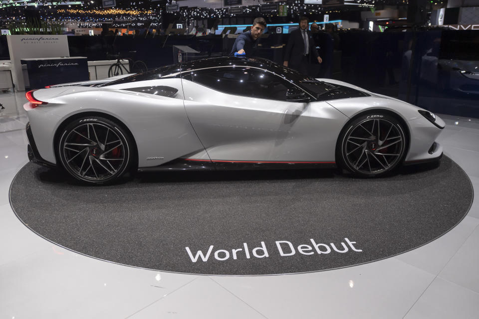 The Pininfarina Battista is presented during the press day at the '89th Geneva International Motor Show' in Geneva, Switzerland, Tuesday, March 5, 2019. The 'Geneva International Motor Show' takes place in Switzerland from March 7 until March 17, 2019. Automakers are rolling out new electric and hybrid models at the show as they get ready to meet tougher emissions requirements in Europe - while not forgetting the profitable and popular SUVs and SUV-like crossovers. (Martial Trezzini/Keystone via AP)