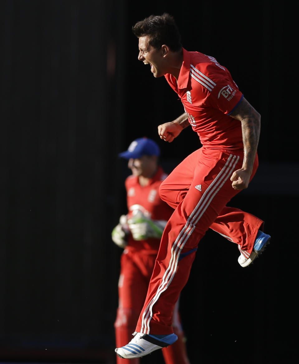 England's Jade Dernbach celebrates after beating West Indes for five runs during their third T20 International cricket match at the Kensington Oval in Bridgetown, Barbados, Thursday, March 13, 2014. (AP Photo/Ricardo Mazalan)