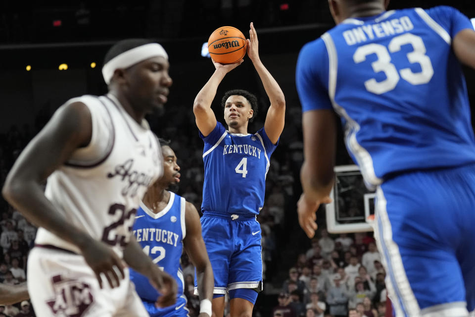 Kentucky forward Tre Mitchell (4) shoots a 3-point basket over Texas A&M during the second half of an NCAA college basketball game Saturday, Jan. 13, 2024, in College Station, Texas. (AP Photo/Sam Craft)