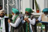 Representatives of various farmers organizations arrive for talks with the government representatives in New Delhi, India, Thursday, Dec.3, 2020. Tens and thousands of farmers have descended upon the borders of New Delhi to protest new farming laws that they say will open them to corporate exploitation. (AP Photo/Manish Swarup)