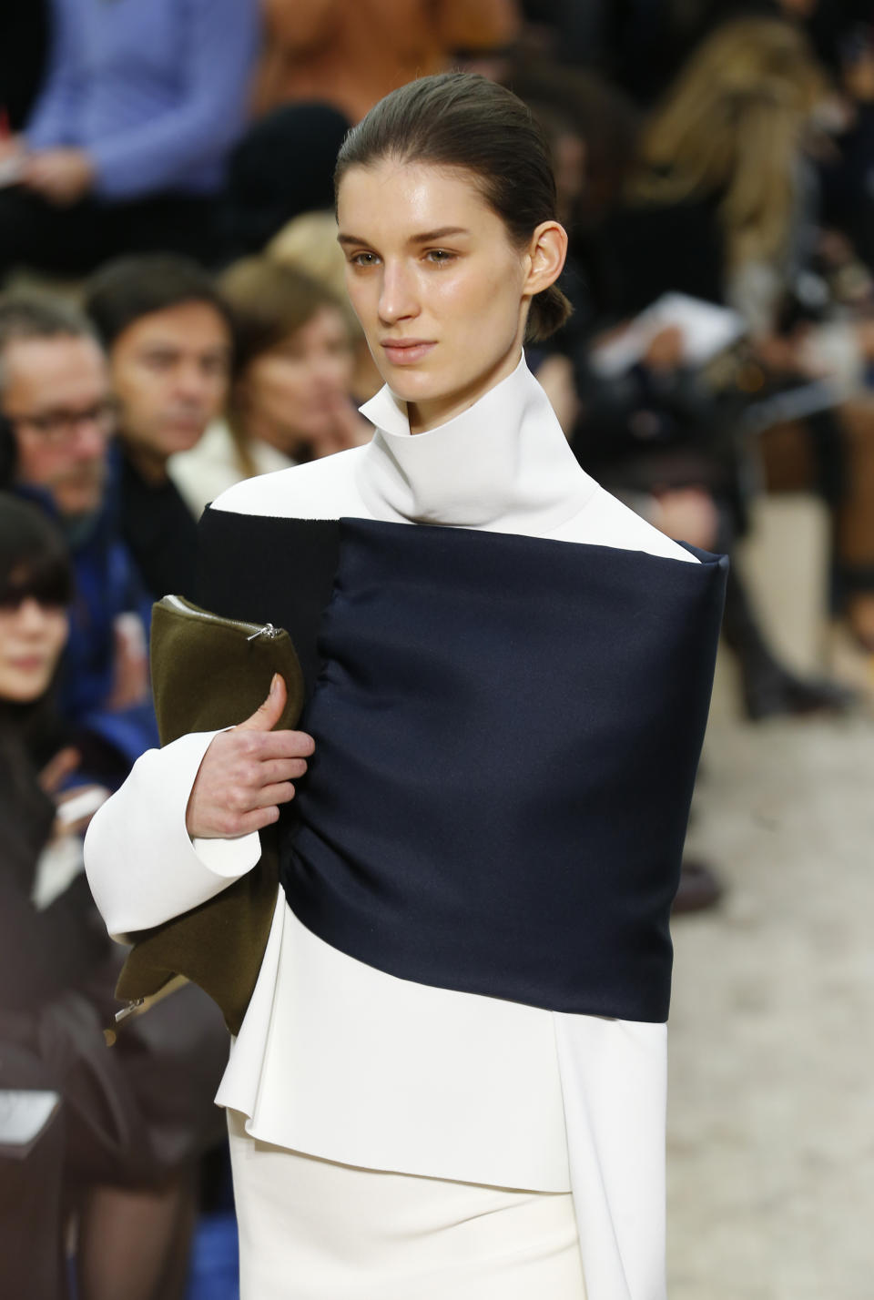 A model presents a creation for Celine's Ready to Wear Fall-Winter 2013-2014 fashion collection, presented Sunday, March 3, 2013 in Paris. (AP Photo/Jacques Brinon)